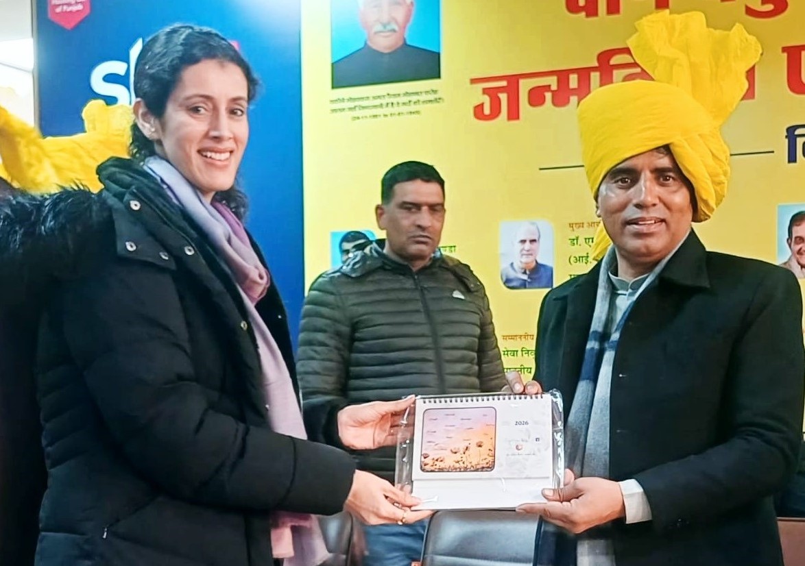 Sarika Malik presenting new year calendars